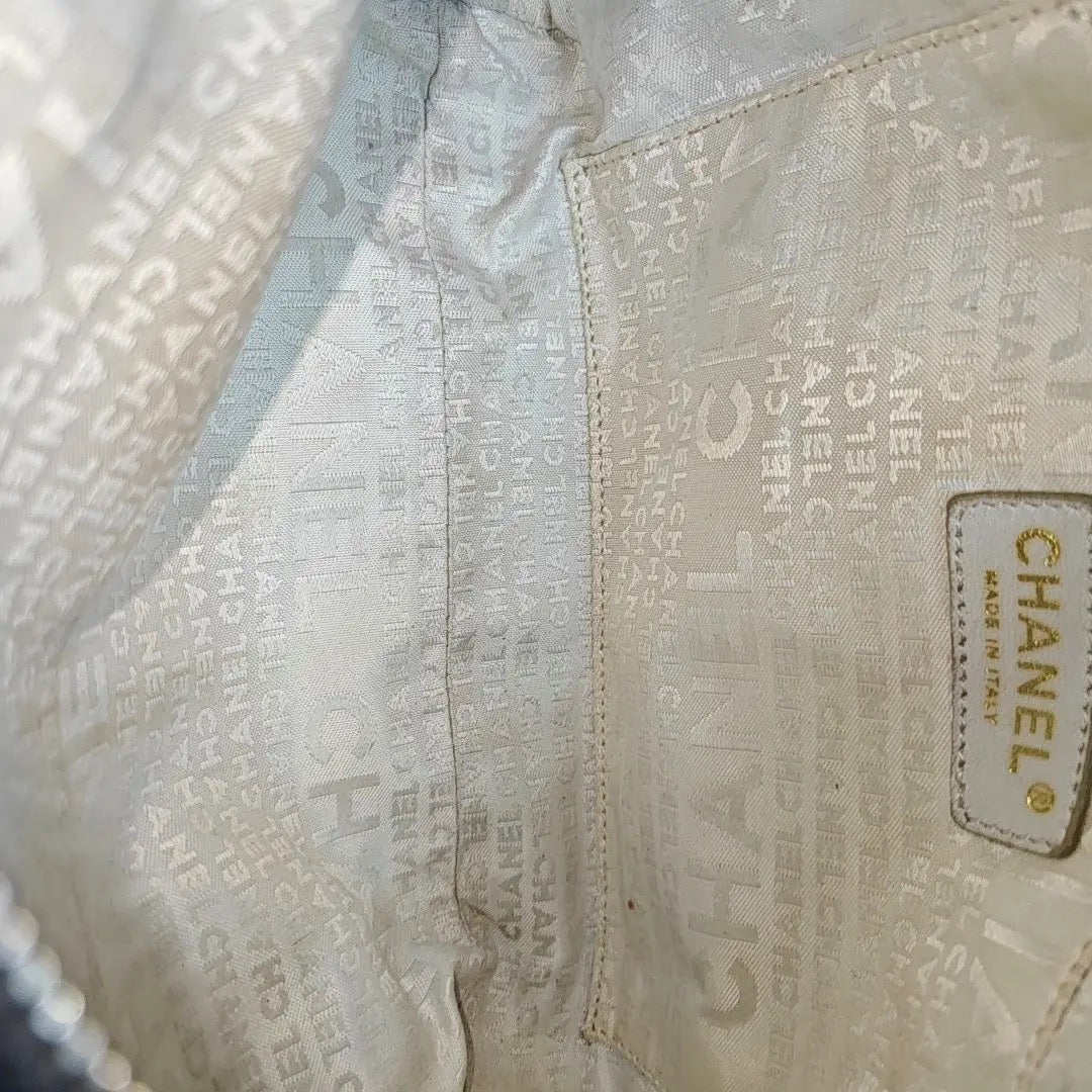 Chanel Black Canvas Shoulder Bag
White Stitching Gold Hardware