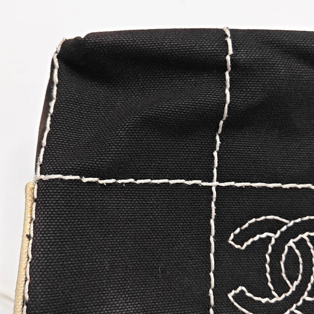 Chanel Black Canvas Shoulder Bag
White Stitching Gold Hardware