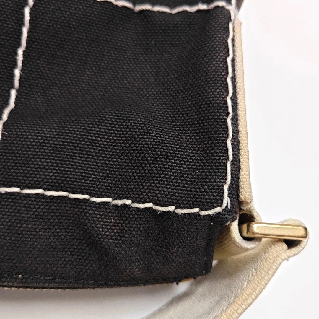Chanel Black Canvas Shoulder Bag
White Stitching Gold Hardware
